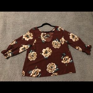 a mid length flowy blouse with an open back